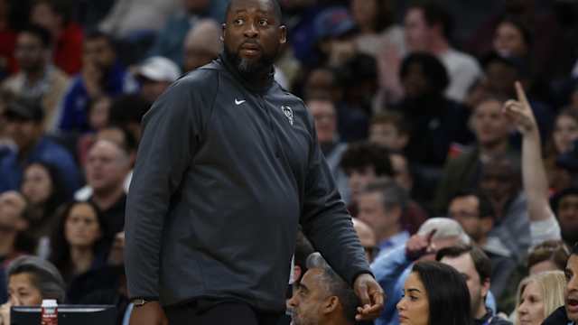 Milwaukee Bucks head coach Adrian Griffin looks on from the bench against the Washington Wizards